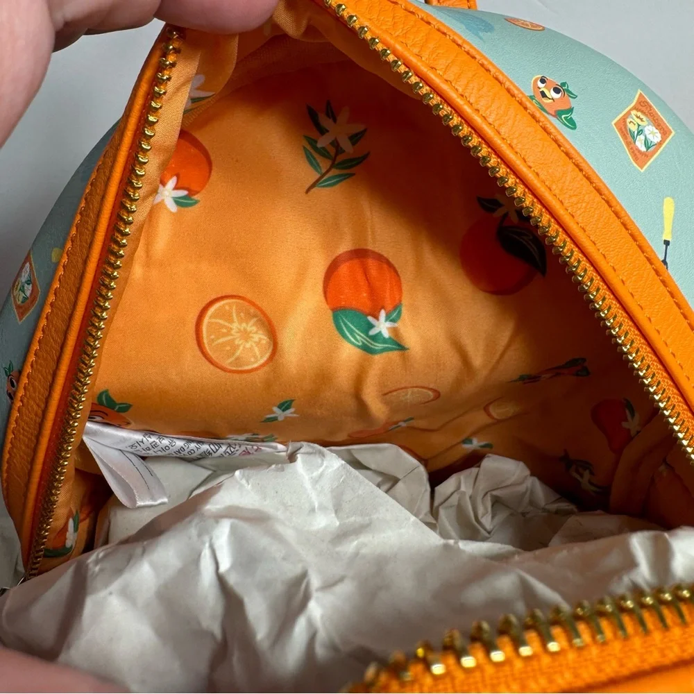 NWT. Disney Loungefly featuring Orange Bird. Approx. 10" H x 9 1/2" W x 5" D - Picture 12 of 14